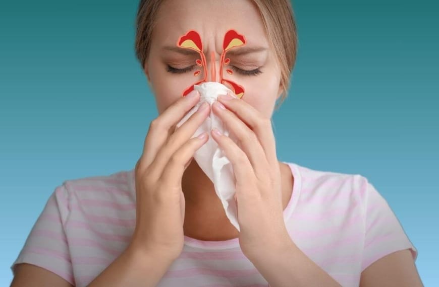 Woman blowing her nose with drawing illustrating her blocked sinuses