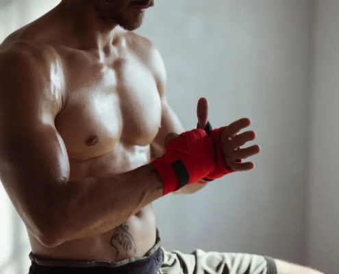 Man wrapping his hand to MMA fight